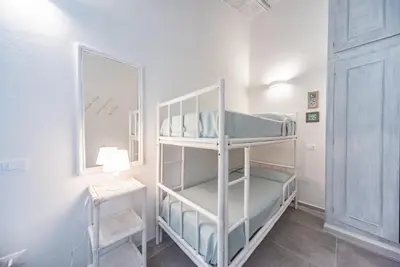Letto o letti in una camera di Villa Aurosa