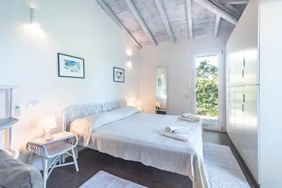 Letto o letti in una camera di Villa Amare
