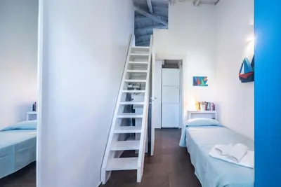 Letto o letti in una camera di Villa Amare