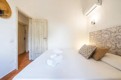 Letto o letti in una camera di Casa Il Lentischio