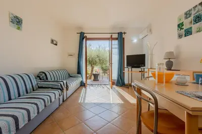 Area soggiorno di GuestHost - Lovely Villa with Garden