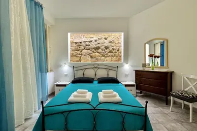 Letto o letti in una camera di House La Marmora 155