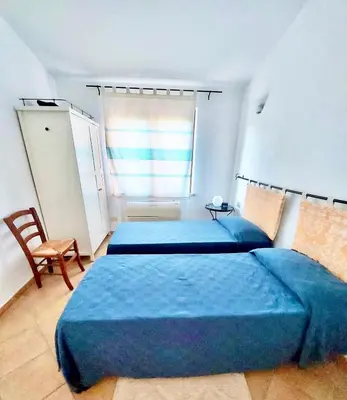 Letto o letti in una camera di Villa Rosmarino in Costa Rei just 400 mt from the sea