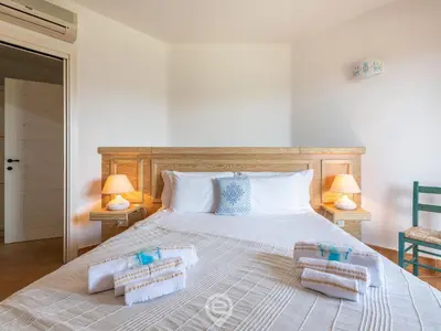 Letto o letti in una camera di Casa Perla