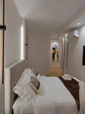 Letto o letti in una camera di Center suite Cagliari