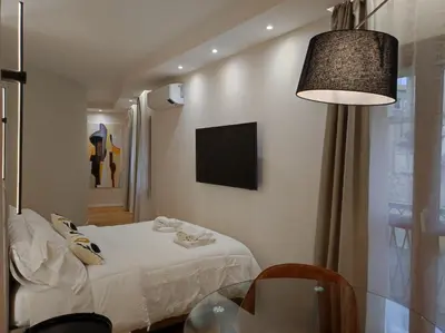Letto o letti in una camera di Center suite Cagliari