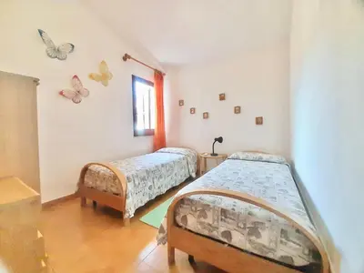 Letto o letti in una camera di Villa Brezza in Costa Rei just 300 mt from the sea