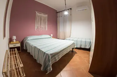 Letto o letti in una camera di Maluma