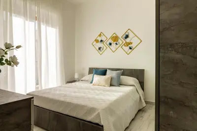 Letto o letti in una camera di Cagliari Center - San Benedetto House 2