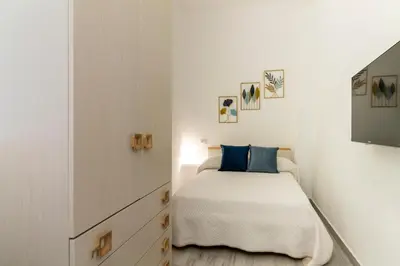 Letto o letti in una camera di Cagliari Center - San Benedetto House 2
