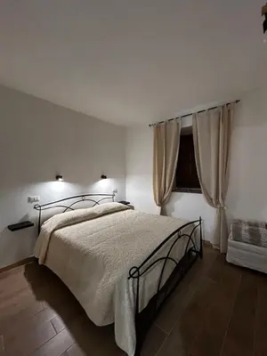Letto o letti in una camera di Domo MamaTzia Rooms