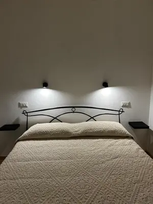 Letto o letti in una camera di Domo MamaTzia Rooms