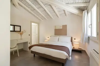 Letto o letti in una camera di Villa Melograno con piscina e giardino privato a soli 500 mt dal mare