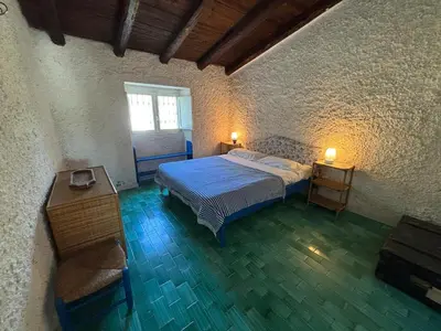 Letto o letti in una camera di Hilltop Sardinian villa - 350m from a wild cove
