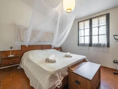 Letto o letti in una camera di Casa Leila