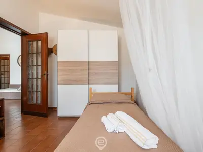 Letto o letti in una camera di Casa Leila