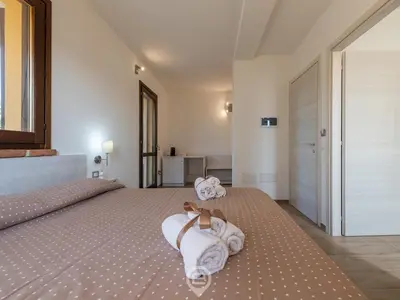 Letto o letti in una camera di Villa Monica