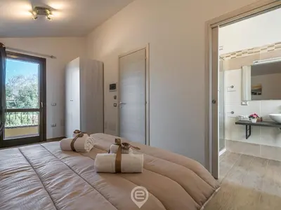 Letto o letti in una camera di Villa Monica
