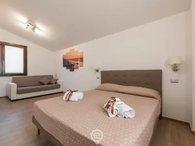 Letto o letti in una camera di Villa Monica