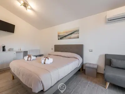 Letto o letti in una camera di Villa Monica