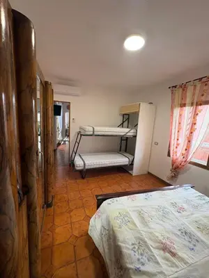 Letto o letti in una camera di Casa vacanze Ginevra Sardegna