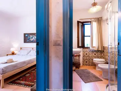 Letto o letti in una camera di Holiday Home Haus in Sant'antioco mit überdachtem Parkplatz by Interhome