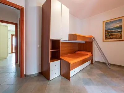 Letto o letti in una camera di Apartment Haus mit Panoramablick in Chia in natürlicher Umgebung by Interhome