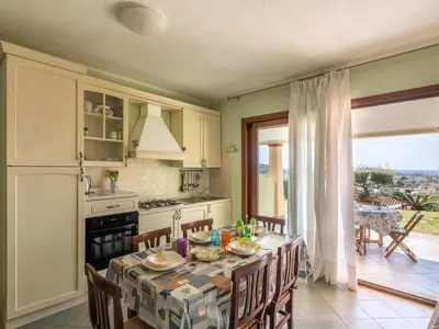 Cucina o angolo cottura di Apartment Haus mit Panoramablick in Chia in natürlicher Umgebung by Interhome
