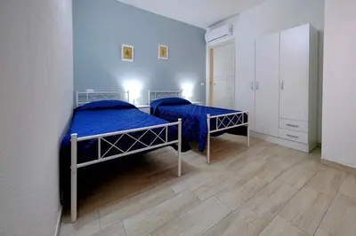 Letto o letti in una camera di Le Magie di Gioba