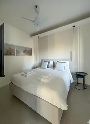 Letto o letti in una camera di KIMO Apartments