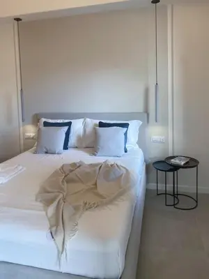 Letto o letti in una camera di KIMO Apartments