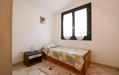 Letto o letti in una camera di 2 Bedroom Nice Apartment In Sant'antioco