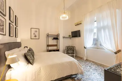 Letto o letti in una camera di CagliariExclusive Parco