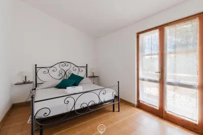 Letto o letti in una camera di Villa Girasole - Petalo Apartment