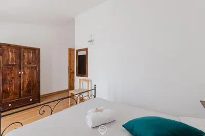 Letto o letti in una camera di Villa Girasole - Petalo Apartment