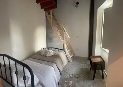 Letto o letti in una camera di Luxar Suites & Apartments