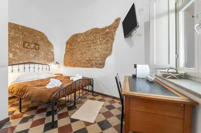 Letto o letti in una camera di Luxar Suites & Apartments