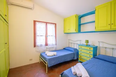 Letto o letti in una camera di S'Omu e Assunta