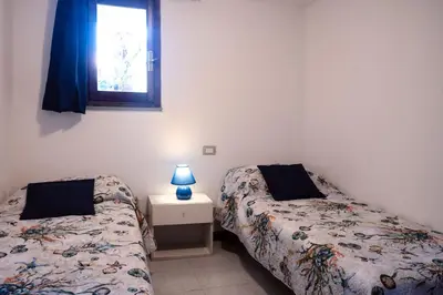 Letto o letti in una camera di Appartamento Villa Barbara Sardinia