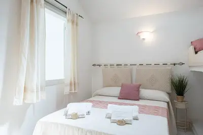 Letto o letti in una camera di Carloforte - Jewel on the seafront promenade