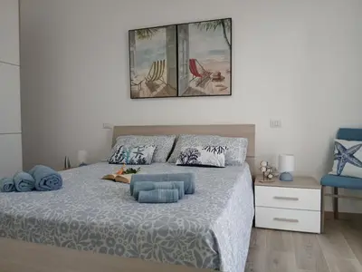 Letto o letti in una camera di Villa con vista mare - Costa Rei
