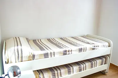 Letto o letti in una camera di S'Arenada 1P, villa only 600m from the beach
