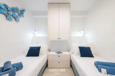 Letto o letti in una camera di Aura Maris - Cala Caterina