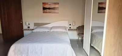 Letto o letti in una camera di Sisters' House