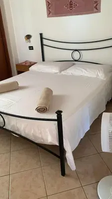 Letto o letti in una camera di VillaOasi