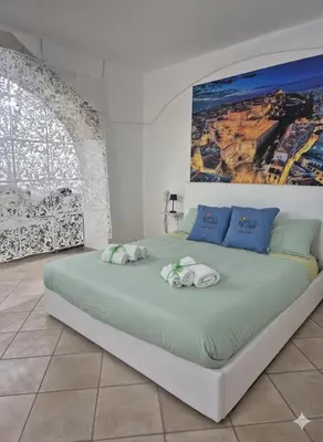 Letto o letti in una camera di Sa domu pitticca Cavour