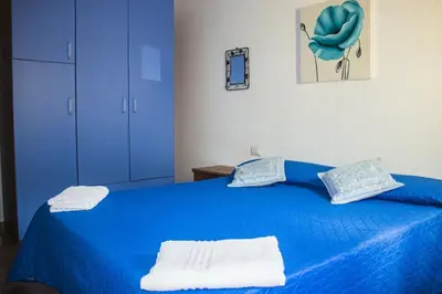 Letto o letti in una camera di Su Moddissi, 250m from the beach