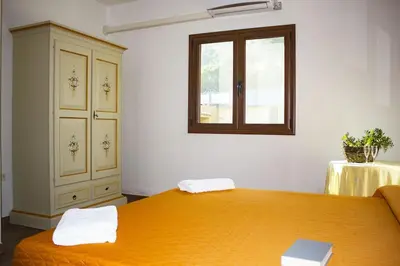 Letto o letti in una camera di Su Moddissi, 250m from the beach