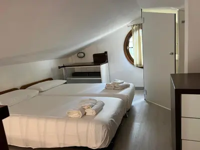 Letto o letti in una camera di Villetta Togo IUN R4848