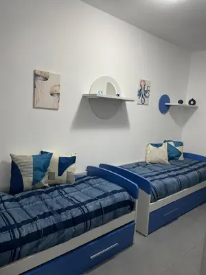 Letto o letti in una camera di Villa Ohana